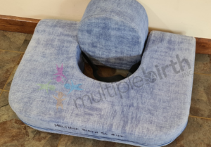 Top view of a small blue U shaped pillow with backrest