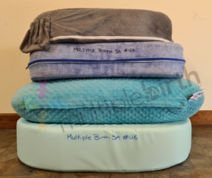 Stack of pillows: My Brest Friend, small U shaped, Twin Z and large U shaped (top to bottom)